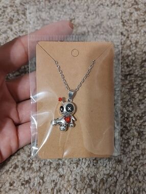 Silver Voodoo Doll Pendant Necklace with Red Accent
